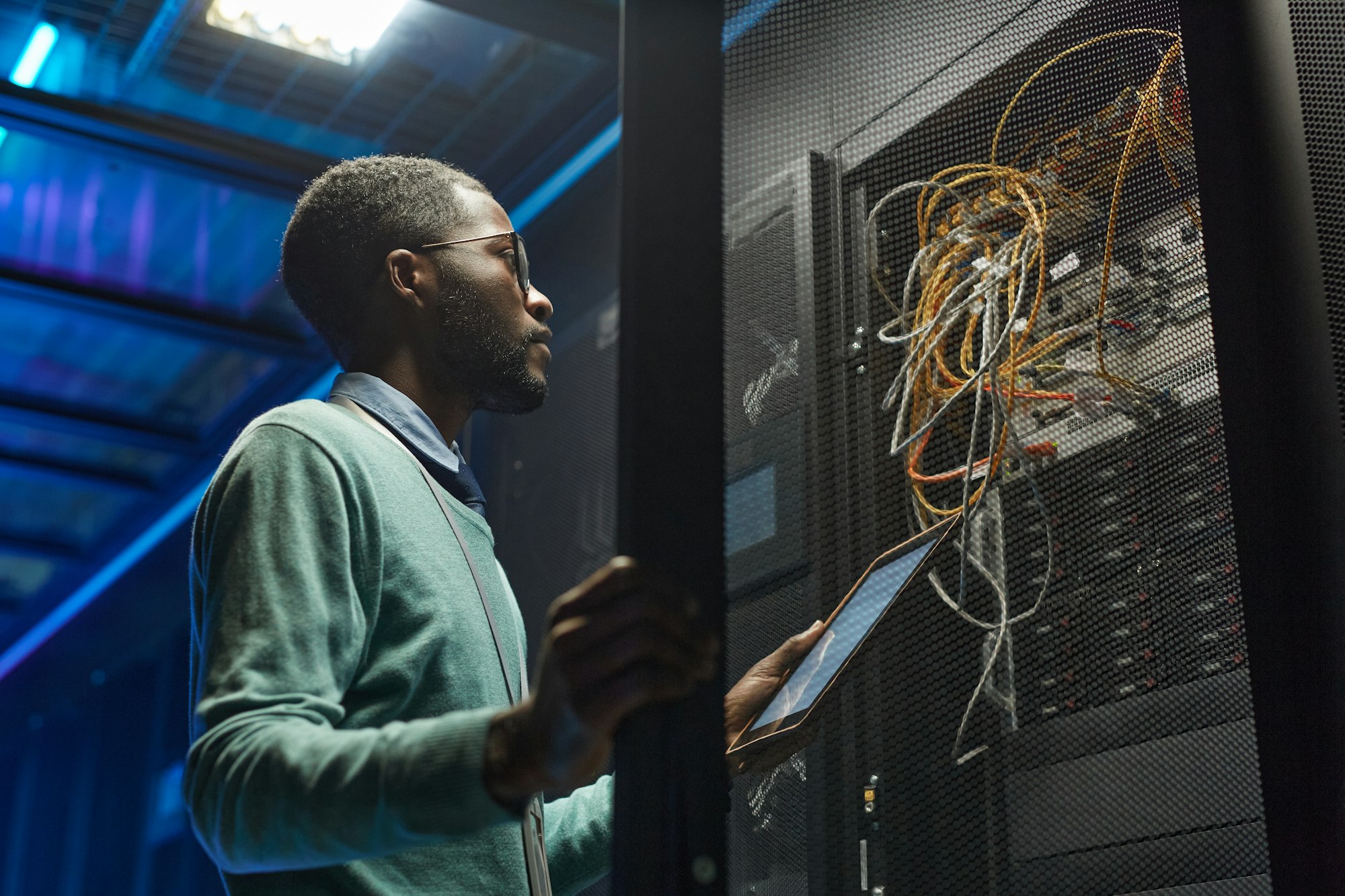 African American Network Engineer Setting Up Server